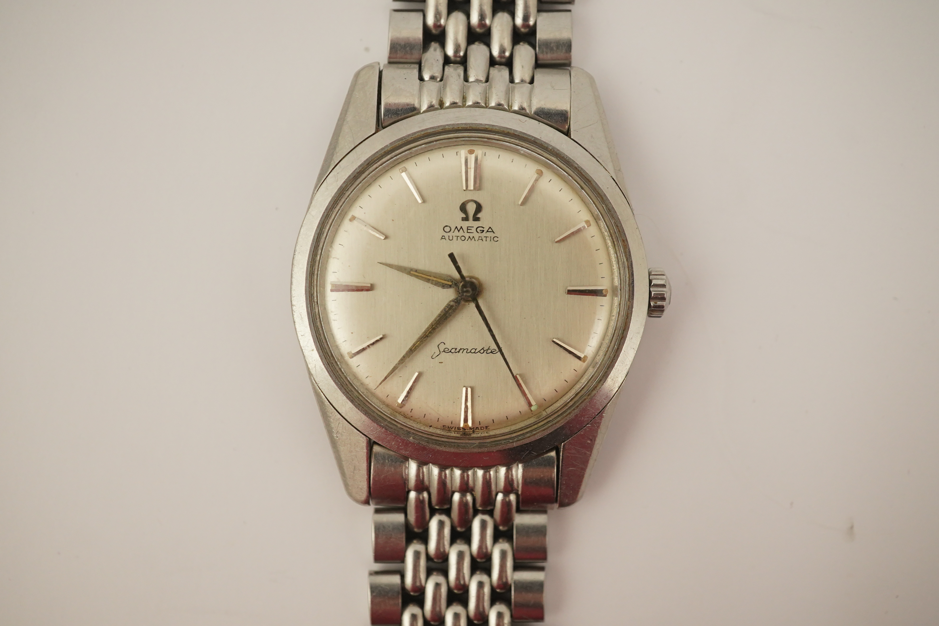 A gentleman's 1960's? stainless steel Omega Seamaster automatic wrist watch, on a stainless steel Omega bracelet